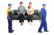 © New Africa - Movers carrying sofa with girls sitting on it against white background