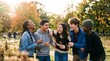 © Mr. Bolota - Diverse group of young friends laughing together outdoors in the fall