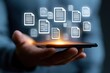 © halawiah - Document management system floating over smartphone with glowing file icons for enterprise data security and cloud storage marketing