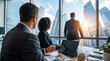 © Christine - Business executives looking out at a vibrant city skyline from a modern office with bright sunlight.