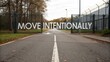 © Amran - Inspirational message on a closed gate encouraging individuals to move intentionally down a deserted pathway surrounded by serene nature and industrial backdrop.