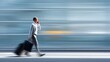 © ЮРИЙ ПОЗДНИКОВ - Business traveler in gray suit strides with carry-on while talking on mobile phone in urban setting