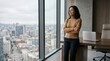 © Таня Андреева - Confident businesswoman looking out office window at city.