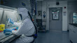 © Teeradej - Ebola virus, biosafety,level, laboratory. Scientist in full protective suit working inside high-security laboratory,