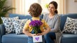 © lutfi - Little Boy Hiding Purple Flowers and Heart Card to Surprise His Mother
