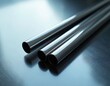 © Vadym - Three polished metal rods rest on a reflective surface. Their smooth cylinders gleam under studio light. This industrial material suggests precision engineering and construction.