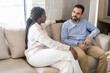 © Hector Pertuz - Woman comforting man having mental health discussion