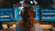 © Cheetose - Woman programmer software developer data analyst computer screen multiple monitor big data code cybersecurity night office technology