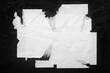 © Yevhenii - Old torn city poster on black background close-up