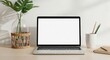 © Saiful - Minimalist home office desk setup with an empty laptop screen for website mockups