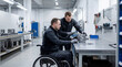 © Iryna - Wheelchair user inspecting component in workshop