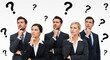 © susral - Thoughtful business team looking up at question marks, perfect for corporate problem solving and decision concepts