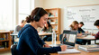 © Xenia - Smiling teenage student wearing headphones and watching a video lecture on a laptop. High school girl writing notes during an online class in a library. Blended learning and digital education concept