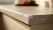 © photo for everything - Close-up of a damaged residential kitchen countertop showing significant wear, a broken edge, and chip detail, highlighting need for repair or renovation