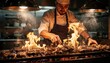 © Justlight - Hot line action with a chef skillfully grilling meats over open flames the intense heat creating a dynamic fiery backdrop.