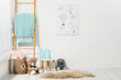 © New Africa - Toys, small chair and wooden ladder near white wall in child's room, space for text