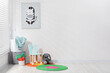 © New Africa - Different toys, small chair, picture and mats in child's room, space for text
