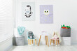 © New Africa - Different toys, small chairs, table and pictures in child's room