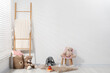 © New Africa - Different toys, small chair and wooden ladder in child's room