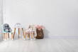 © New Africa - Different toys, small chairs and table in child's room, space for text