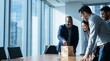 © Clark Still - Colleagues gather around a wooden block tower during a meeting in a bright corporate conference room.
