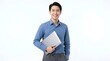 © Inchiban - Smiling Asian businessman holding a laptop in a studio with a clean white background.