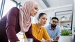 © firdol - Focused Diverse Business Team Working Together on Computer in Modern Office