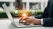 © Love - Businessman working on laptop outdoors with icons floating above keyboard