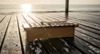 © Akstem - Xylophone on a wet wooden dock by the sea at sunrise or sunset