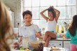 © peopleimages.com - College, dorm and friends in kitchen for breakfast, meal and prepare pancakes in morning together. Apartment, students and women with ingredients for food, snack and flapjacks on weekend in hostel