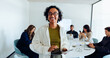 © Julia - Woman leads a diverse UX team meeting