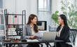 © Kritdanai - Consultation in a Modern Office: Two professional women engage in a discussion over documents at a desk in a bright, contemporary office, with a laptop, files.