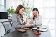 © Kritdanai - Legal Consultation: A concerned client discusses legal matters with a legal professional, with a scale of justice and a gavel on the desk symbolizing the legal system.