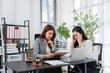 © Kritdanai - Legal Consultation Stress: A lawyer calmly reviews a document with a distressed client in an office setting, highlighting the emotional toll of legal matters.