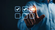 © Rahima - Hand touching glowing checkmark in digital interface with glowing particles checklist