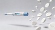 © Olga Ко - .GLP1 medication concept. A GLP-1injection pen and white flying tablets with GLP-1 text. Transition from injectable to oral treatment for weight loss and diabetes