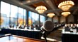 © Fitrah - Microphone on a podium in a conference hall with attendees blurred in the background.