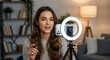© RATUL HASAN - Young woman vlogging with ring light and smartphone for online content creation during a home session