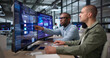 © Andrey Popov - Two Young Data Analysts Reviewing Financial Dashboard