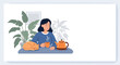 © Ovi - Peaceful scene of a woman drinking tea at a table with her sleeping cat and houseplants in a cozy home interior setting.