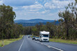 © Austockphoto - Campervan traveling along highway road going on holiday trip