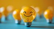© MiltonKumar - Happy idea concept with smiley bulb in warm light photo