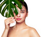 © Oleg Gekman - Close up woman face with green exotic leaf. Skin care beauty treatments concept. Model with clean, health skin of face. Monstera Leaves