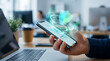 © farah - Hand holding smartphone with holographic shield security concept in modern office setting