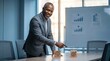 © Clark Still - Executive leans over a meeting table with strategy cubes in a bright office conference setting.