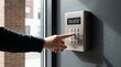 © mother - Digital security keypad on office wall, hand entering access code, electronic door lock system for building safety