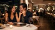 © Ethan - Happy couple laughing during a romantic dinner date at a fancy restaurant