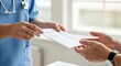 © vallerion - A healthcare professional in blue scrubs hands an envelope to another person, symbolizing a medical transaction or information exchange.