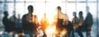 © Rahman - Silhouetted business people in a meeting room at sunrise, double exposure