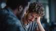 © Olya Pilipchik  - Stressed young man receiving support and empathy from a friend during a difficult time, dealing with mental health challenges and seeking help